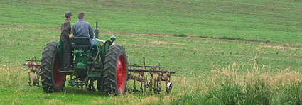 Joseph and Daniel heading out to cultivate soybeans, June 2006...Click to see more photos from our farm!