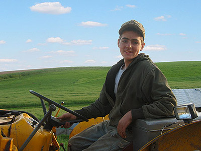 Daniel and his first tractor, nicknamed 'Fergy'